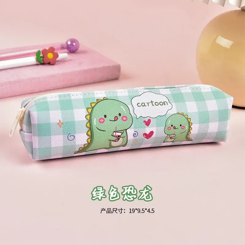 Green dinosaur-themed pencil case with playful cartoon dinosaurs drinking juice, decorated with hearts and speech bubbles, fun for kids.