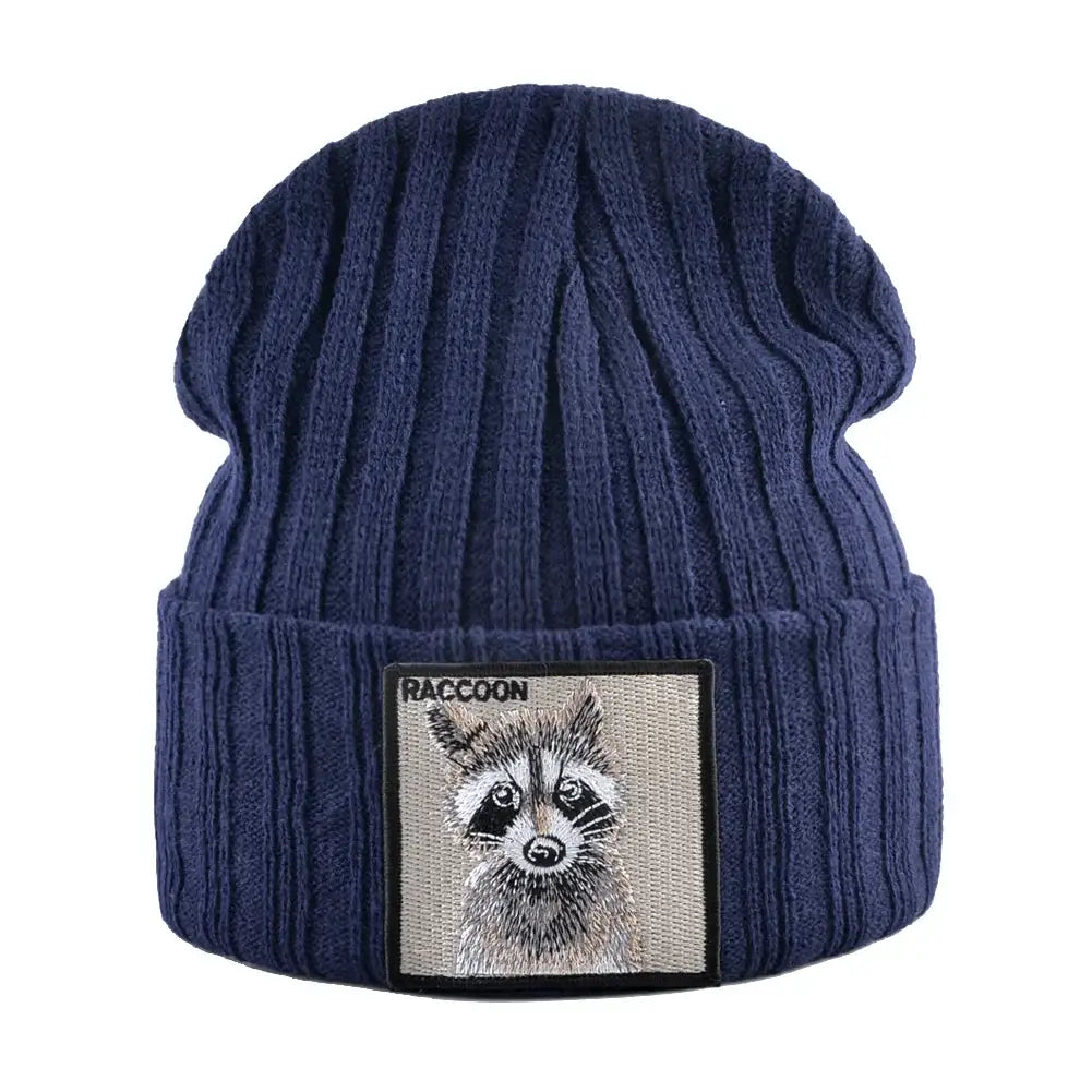 Beige ribbed knit beanie with raccoon patch, measuring 23cm height and 22cm width, featuring a raccoon illustration patch, perfect for winter.