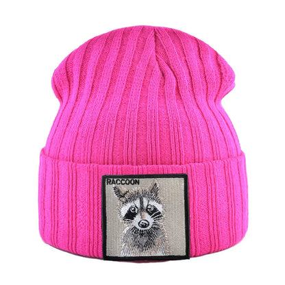 Bright pink knitted beanie with ribbed texture and raccoon patch embroidery, warm unisex winter hat for cold weather