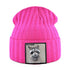 Bright pink knitted beanie with ribbed texture and raccoon patch embroidery, warm unisex winter hat for cold weather