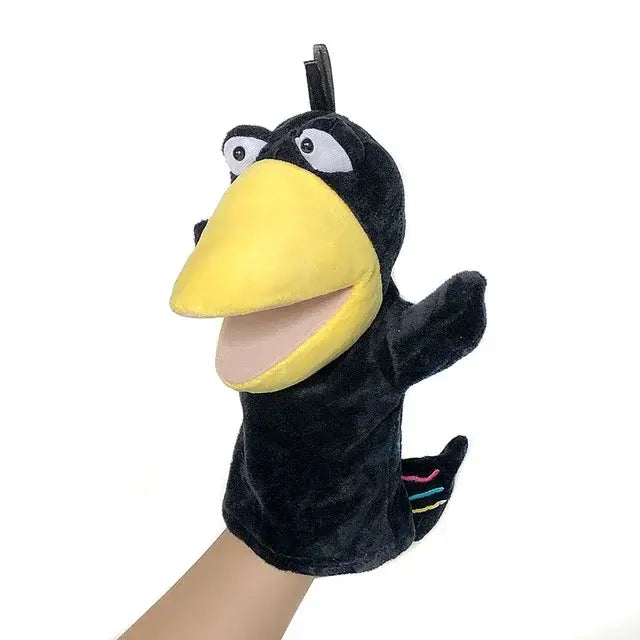 Eine schwarze Tier Handpuppe mit gelbem Schnabel und großen Augen, ideal für kreatives Spielen mit der Petoria™ Tier Handpuppe Deluxe.