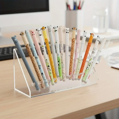 Collection of colorful gel pens with animal-themed prints displayed in a clear pen holder on a desk, perfect for creative projects and writing