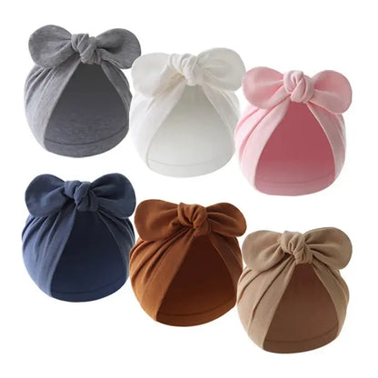 Baby turban hat with bow in gray soft cotton, stylish and comfortable for everyday wear, ideal for infants and toddlers.