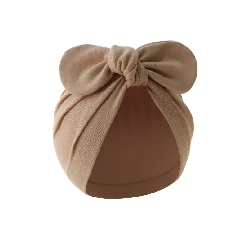 Baby turban hat with bow in brown cotton, warm and stylish for babies, perfect for cooler days and casual wear.