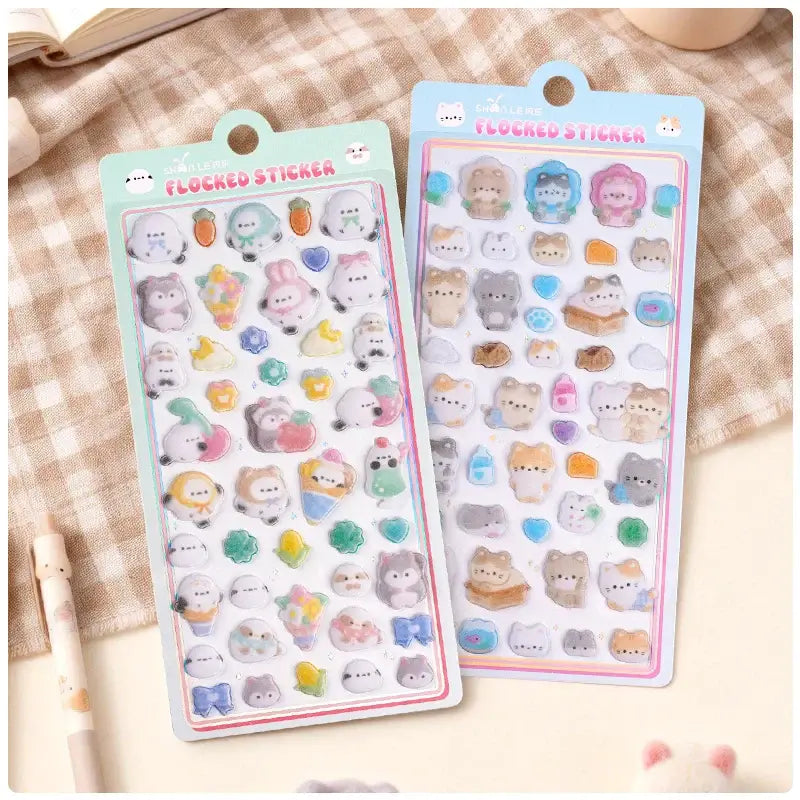Collection of colorful 3D animal and shape stickers with glitter, including bears, hearts, and stars on sticker sheets.