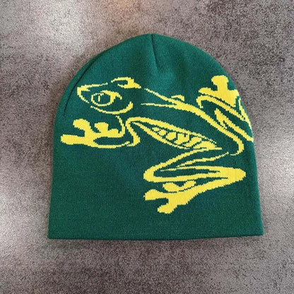 Green unisex beanie with yellow dragon design, cozy knit fabric, ideal for autumn and winter, fashionable headwear.