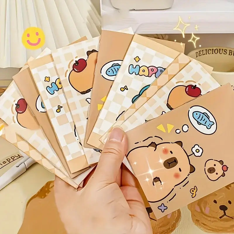 Set of 10 cute pet-themed mini notepads featuring adorable cartoon capybaras, fish, and bears, perfect for notes and lists