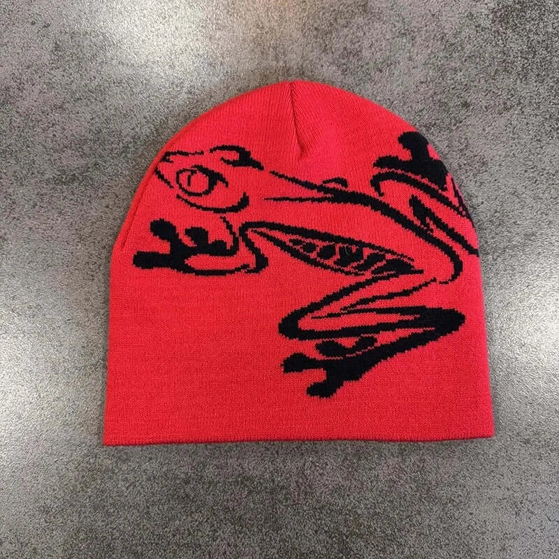 Red unisex beanie with black dragon graphic, soft knit fabric, suitable for fall and winter, stylish and comfortable headwear.