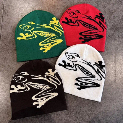 Black and white knitted beanie with dragon design, measuring 21cm in height and 20cm in width, suitable for winter warmth.