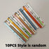 Collection of 10 gel pens with animal motifs, featuring playful caps with panda, bear, and giraffe designs, ideal for school and stationery lovers