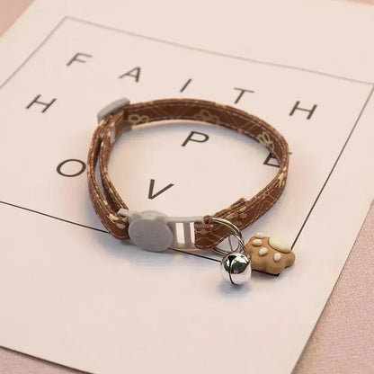 Verstellbares Haustierhalsband mit Glocke und Pfotenmotiv Petoria