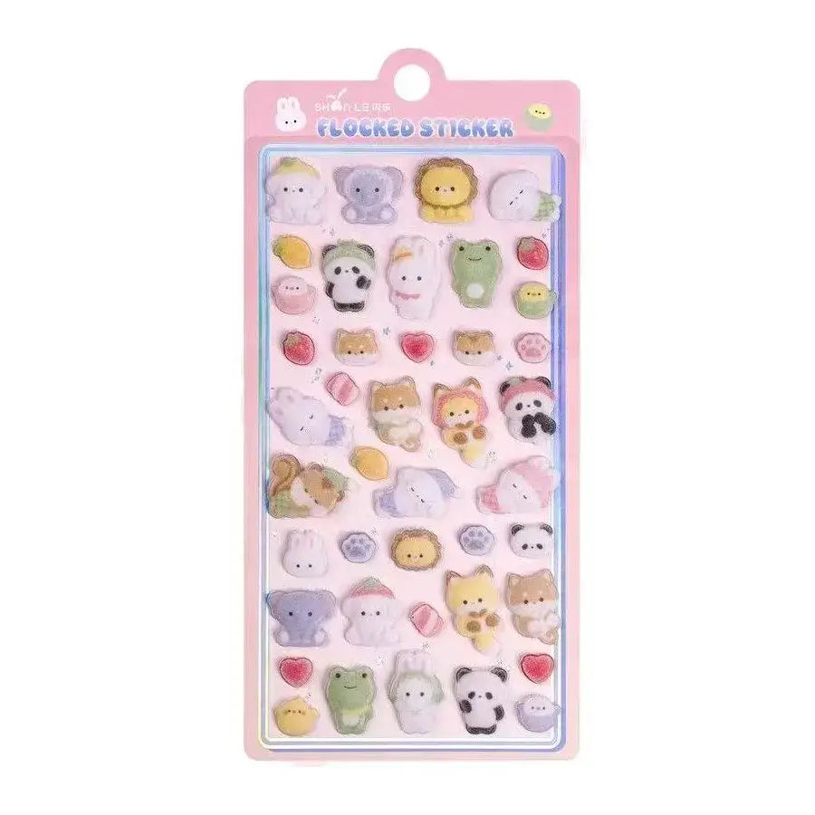 Sheet of Petoria® Puffy animal stickers with diverse animal faces including cats, dogs, and pandas, in soft pastel shades for creative use.