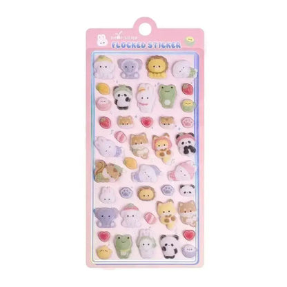 Sheet of Petoria® Puffy animal stickers with diverse animal faces including cats, dogs, and pandas, in soft pastel shades for creative use.