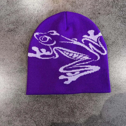 Purple unisex beanie with white dragon motif, warm knitted material, perfect for cold weather, trendy winter accessory.