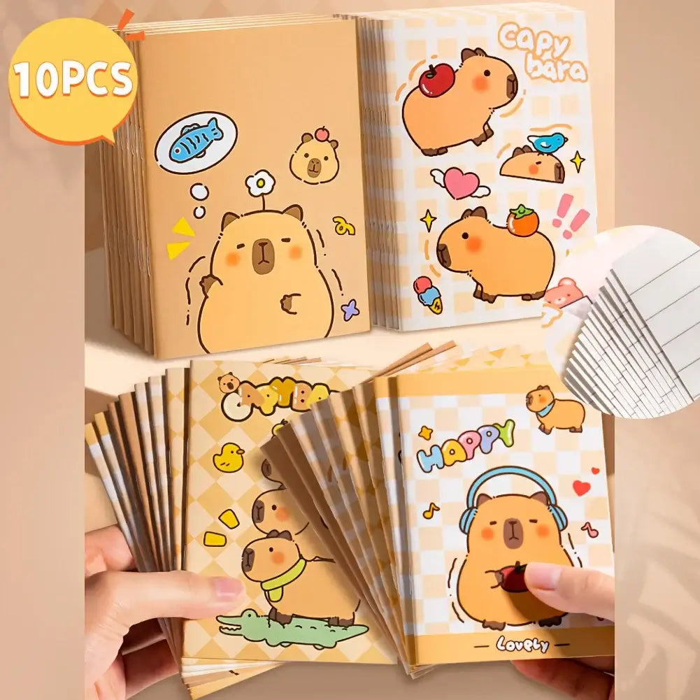 Open mini notepad with lined pages and colorful cartoon capybaras, fish, and bears, ideal for school, office, and daily use