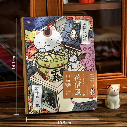 Katzenmotiv Reise-Notizbuch mit charmantem Design und Katzenillustrationen auf dem Cover.