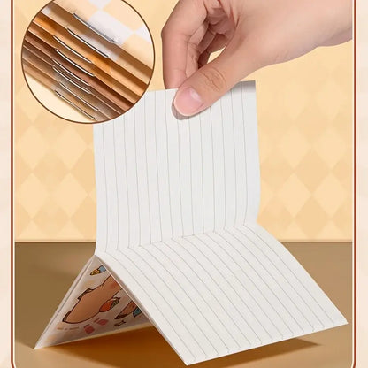 Close-up of lined pages in a mini notepad showing cute animal drawings, perfect for jotting down quick notes and reminders