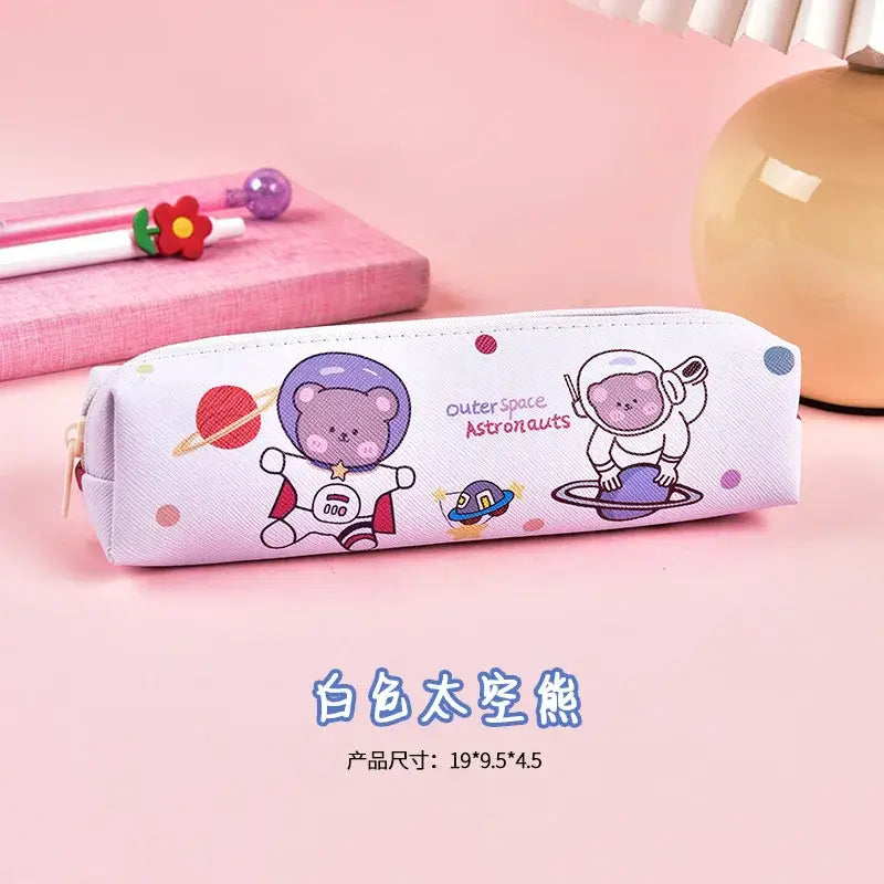 Pink pencil case with space-themed bear and astronaut illustrations, ideal for kids to organize pens and stationery, playful design.