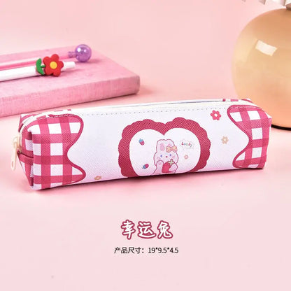 Pink gingham pencil case with adorable cartoon bear and heart speech bubble design, suitable for children’s school supplies.