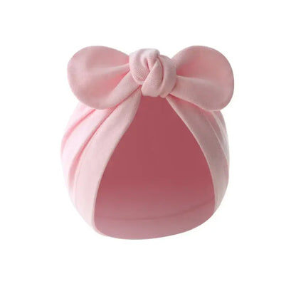Baby turban hat with bow in navy blue cotton, comfortable and trendy for infants, great for outdoor activities.