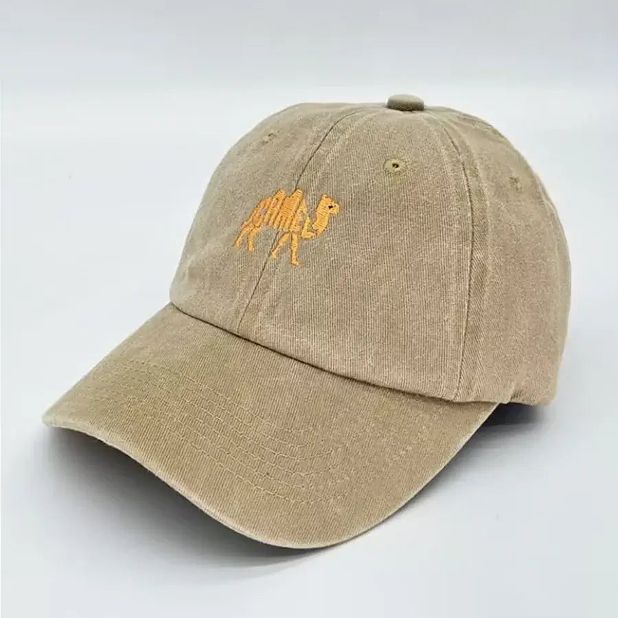 Beige cotton baseball cap with embroidered camel logo, curved brim, adjustable strap, showing interior lining and size