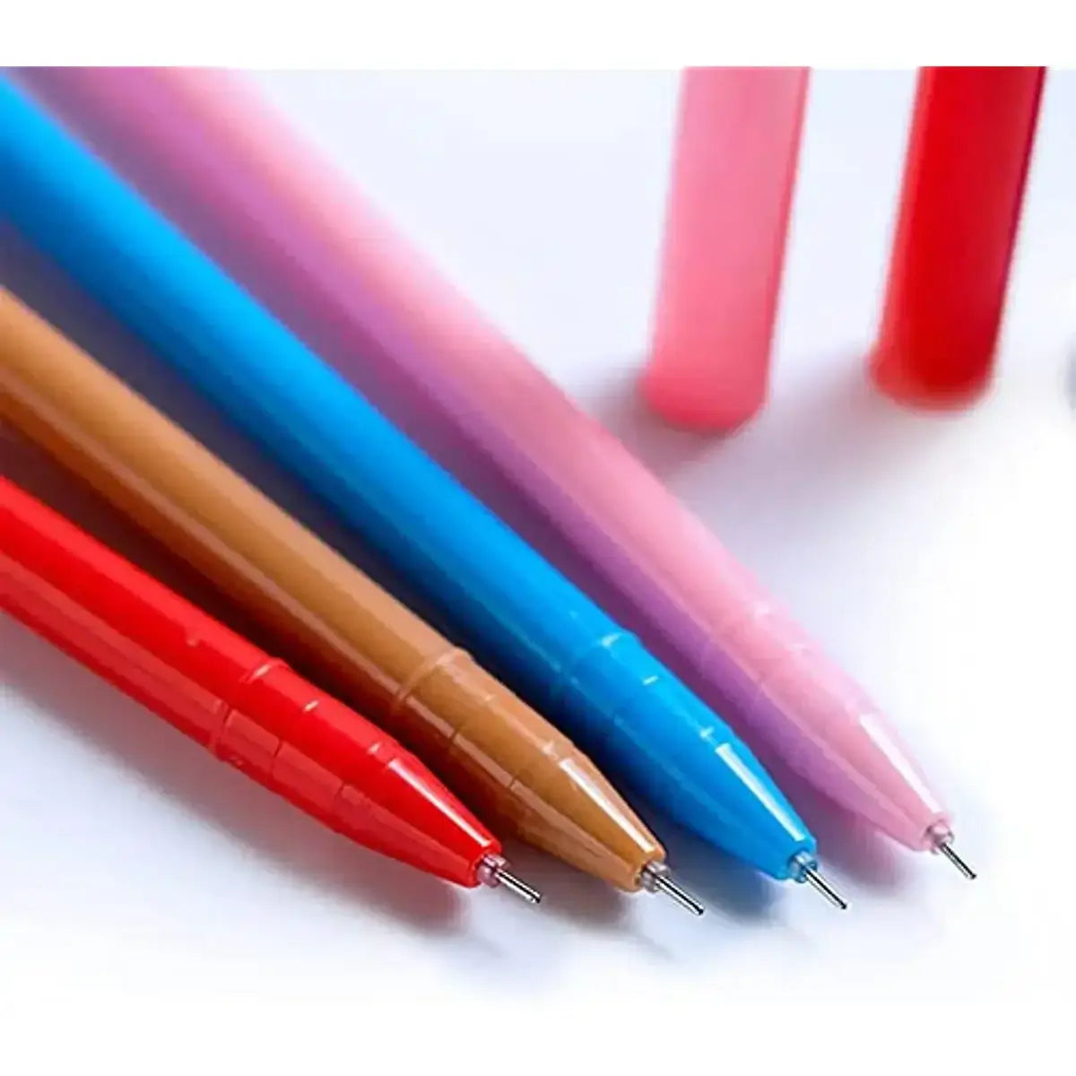 Close-up of gel pens with animal toppers in red, brown, pink, blue, and purple colors on a white background